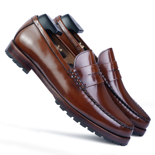 Side view Brown colour Round toe Penny loafer formal shoes in leather with Blake stitched leather sole