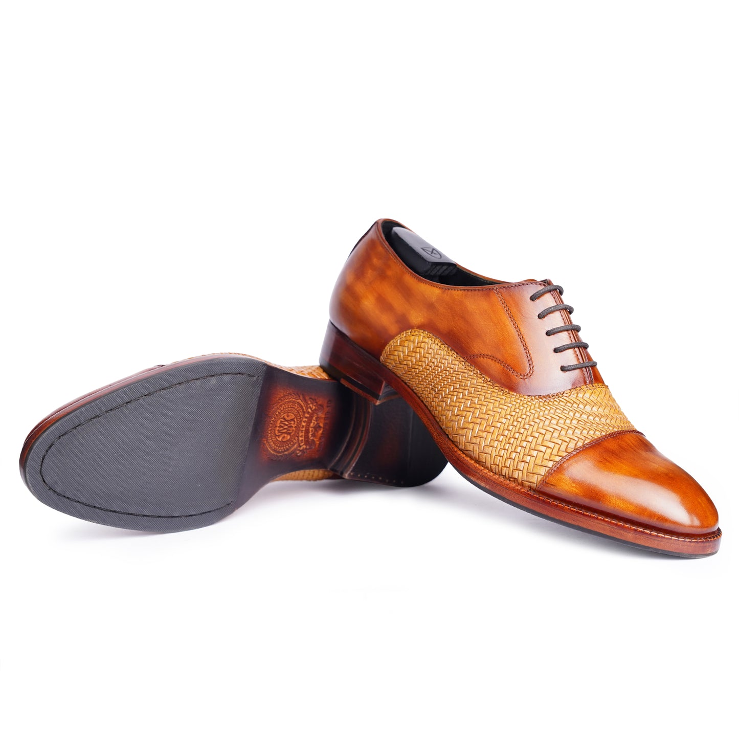 Side and outsole view of Two tone Spectators in Brown colour Captoe formal shoes in leather with Blake stitched leather sole
