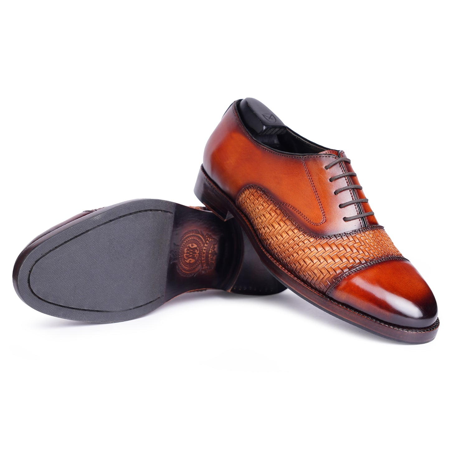 Outsole view of Two tone Spectators in Reddish Brown colour Captoe formal shoes in leather with Blake stitched leather sole
