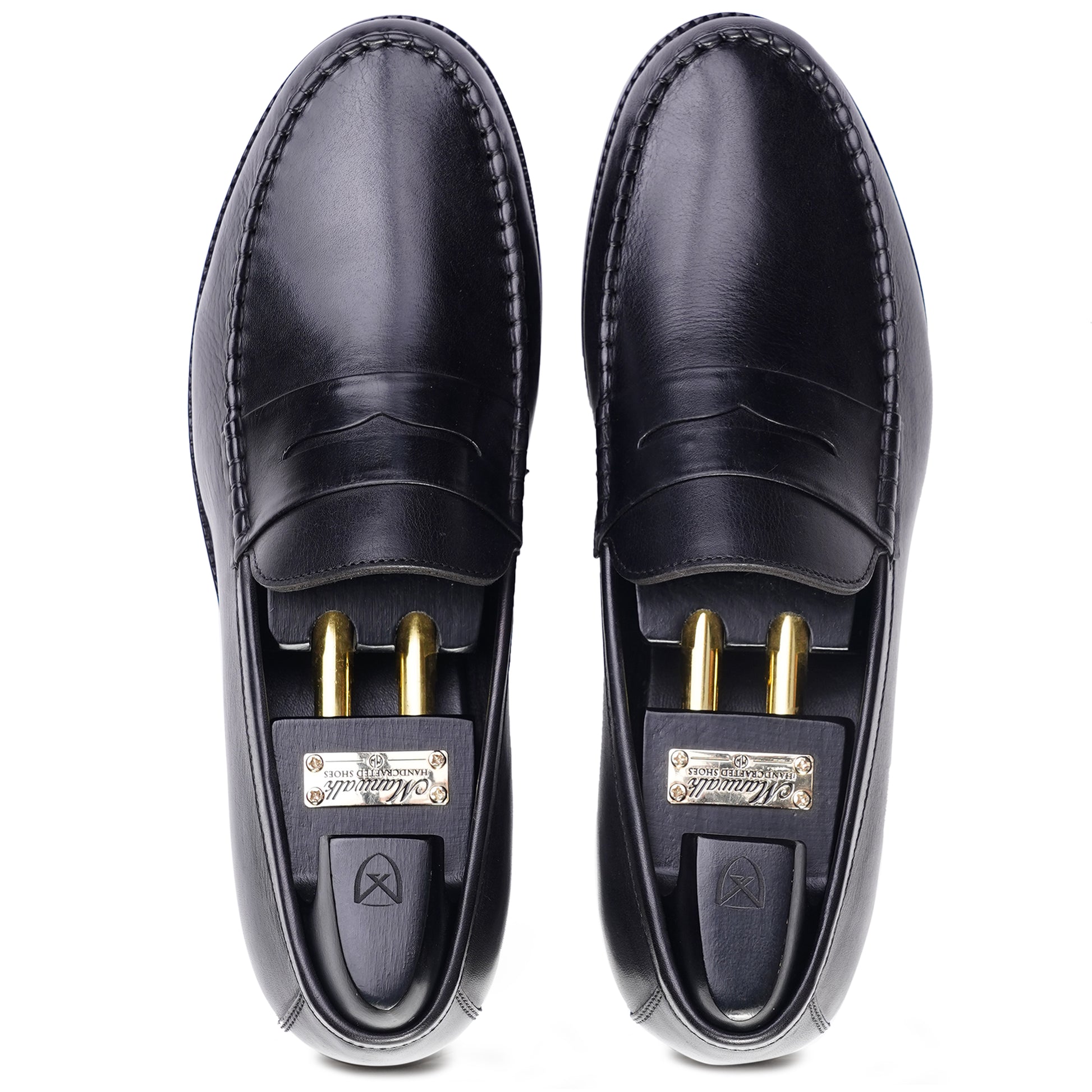 Top view Black colour Penny loafer formal shoes in leather with Blake stitched leather sole
