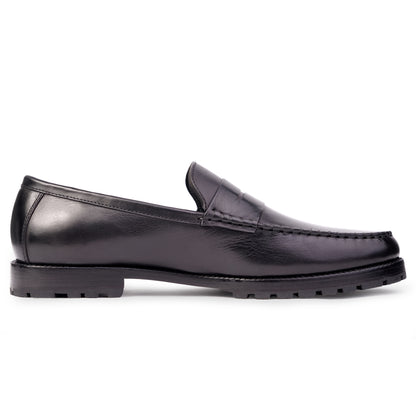 Side view Black colour Penny loafer formal shoes in leather with Blake stitched leather sole
